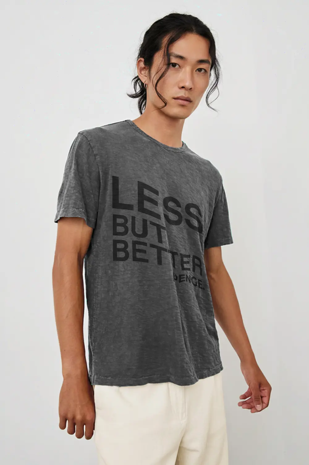 Man wearing the LESS BUT BETTER tee